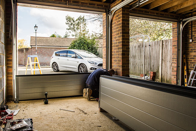 Access Garage Doors expert installing new garage doors panels